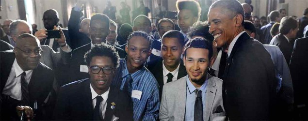 Students pose with President Obama at the launch of My Brother’s Keeper alliance at Lehman College in the Bronx, N.Y., in May. (Susan Watts/The Daily News via AP)
