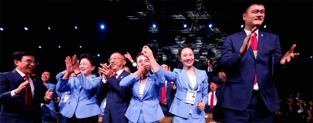 Members of the Chinese delegation react after Beijing was selected to host the 2022 Olympic Winter Games. (Vincent Thian/AP)