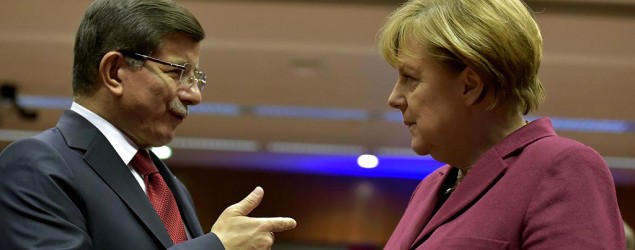 Turkish Prime Minister Ahmet Davutoglu, left, talks with German Chancellor Angela Merkel. (Reuters)